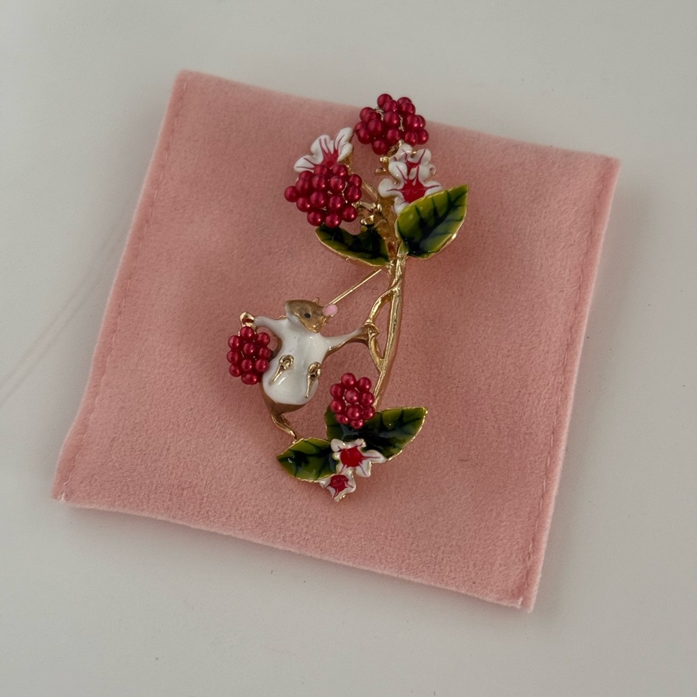 Elegant Floral Brooch with Red and Green Accents